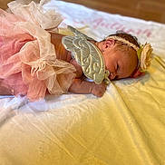 Aaliyah joined the competition — help win amazing prizes! baby, infant, angel, tutu, headband, flower, blanket, lying_down, cute, soft, newborn, peaceful, pink, wings, decorative, portrait, indoors, child, sleepy, adorable