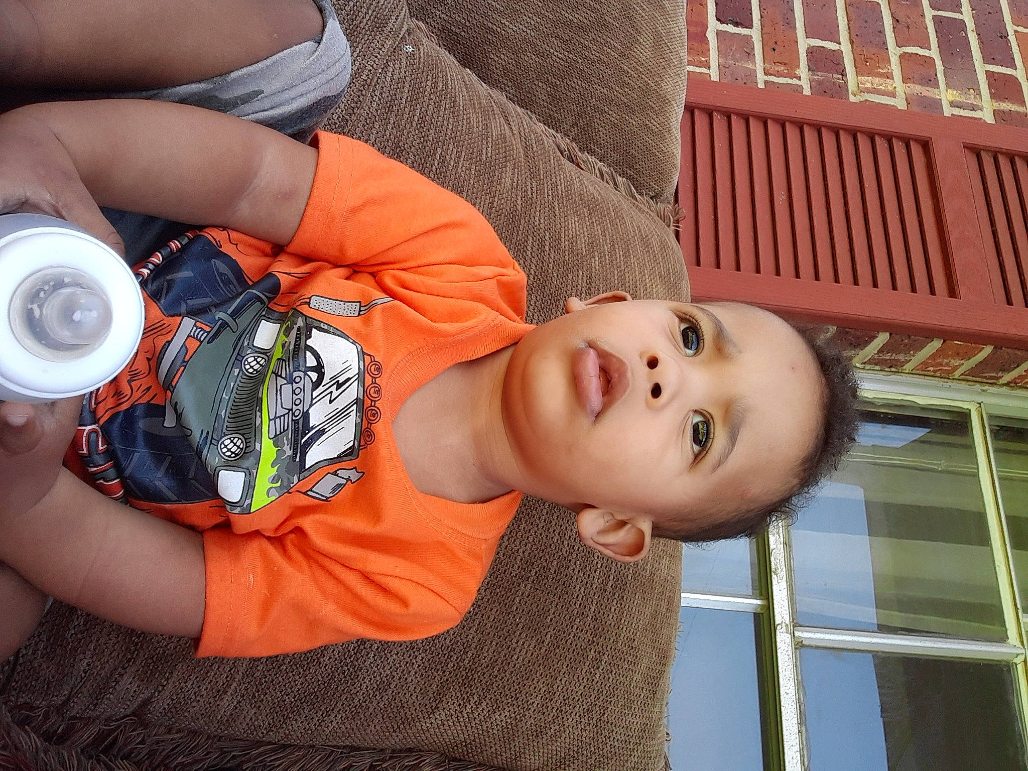 Ethan is registered to the contest to win money with this photo: baby, baby_products, baby_toddler_clothing, child, drinking, elbow, facial_expression, fun, happy, hat, leisure, mouth, person, product, sitting, smile, toddler, vacation, window, wood