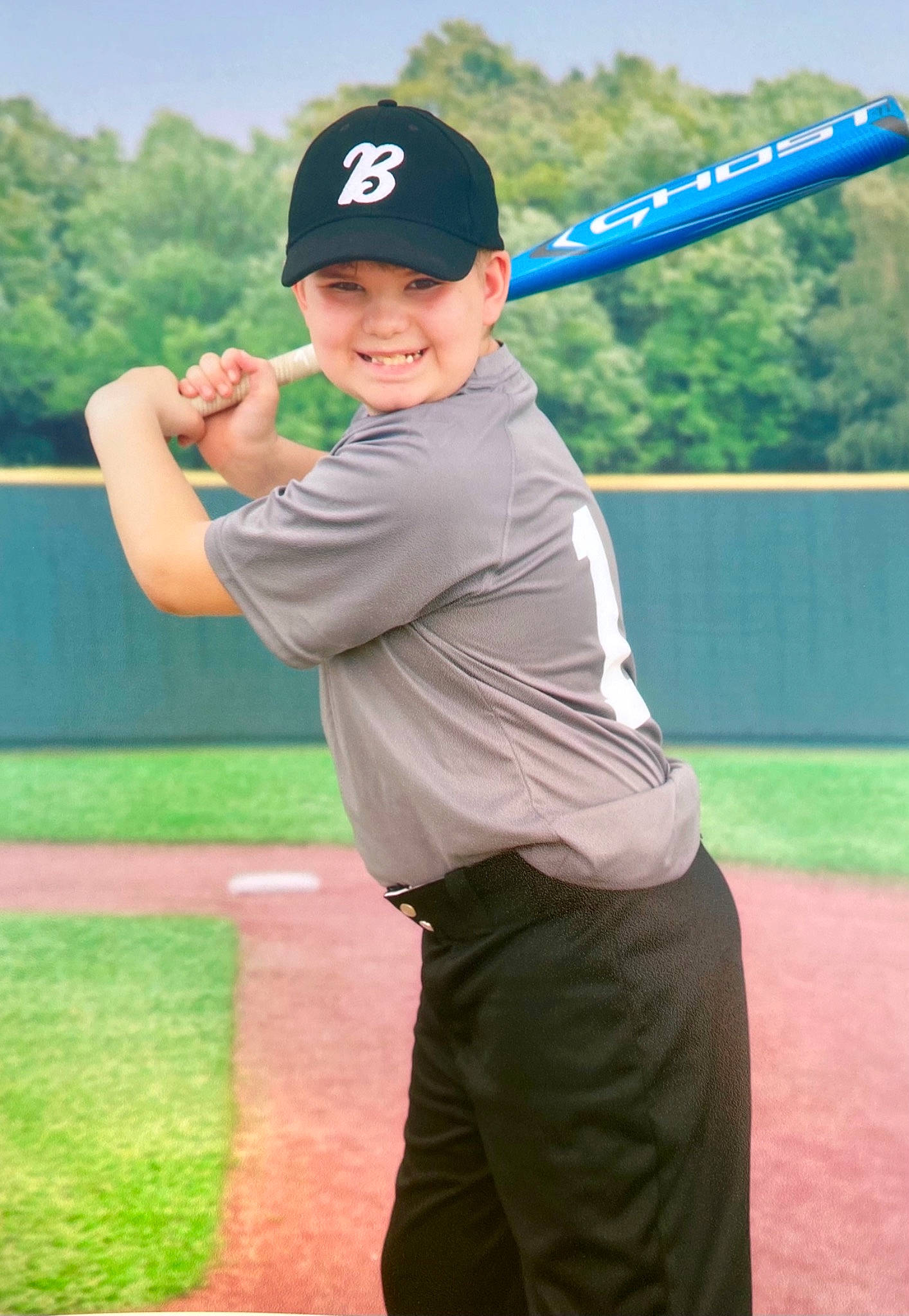 Erik is registered to the contest to win money with this photo: arm, baseball, baseball_bat, baseball_cap, baseball_equipment, baseball_field, baseball_park, baseball_player, bat_and_ball_games, cap, college_baseball, elbow, grass, headwear, human_body, joy, person, player, sky, smile