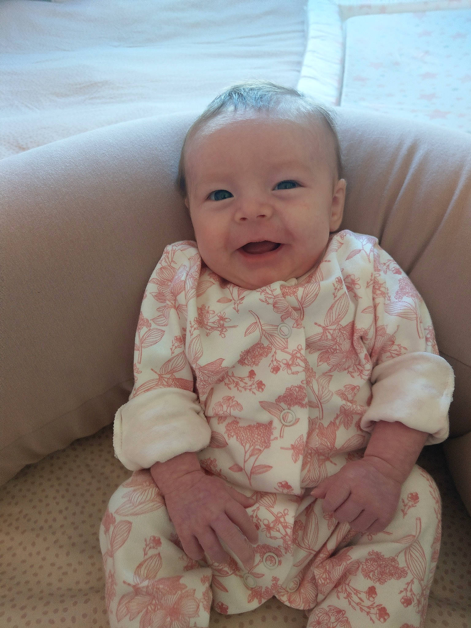 Ayda is registered to the contest to win money with this photo: baby, baby_toddler_clothing, cheek, chin, comfort, dress, eye, face, head, human_body, iris, lip, mouth, nose, person, pink, skin, sleeve, smile, textile