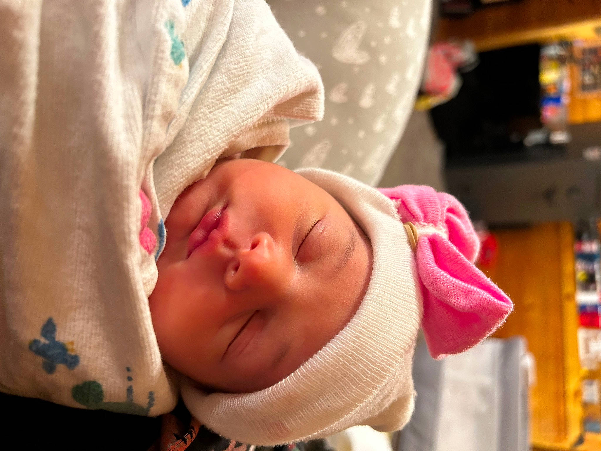 Harley is registered to the contest to win money with this photo: baby, baby_products, baby_toddler_clothing, cheek, child, comfort, eyelash, face, happy, headgear, headwear, lip, nose, person, product, room, shelf, skin, sleeve, smile