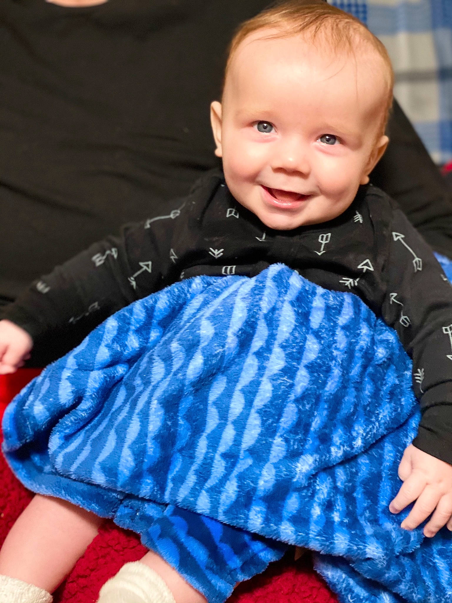 Maverick is registered to the contest to win money with this photo: baby, baby_toddler_clothing, blue, cheek, electric_blue, eye, face, flash_photography, gesture, happy, head, iris, joy, outerwear, person, purple, red, skin, sleeve, smile