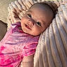 Maya joined the competition — help win amazing prizes! baby, infant, smile, pink_clothing, tie_dye, blanket, soft_texture, cozy, happy, face, child, couch, home, portrait, person, cute, young, skin, head, resting