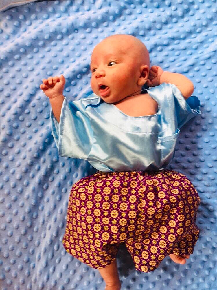 Dominic joined the competition — help win amazing prizes! arm, baby, baby_products, baby_toddler_clothing, child, electric_blue, fun, hand, happy, linens, orange, pattern, person, plaid, purple, sitting, sleeve, t_shirt, textile, toddler