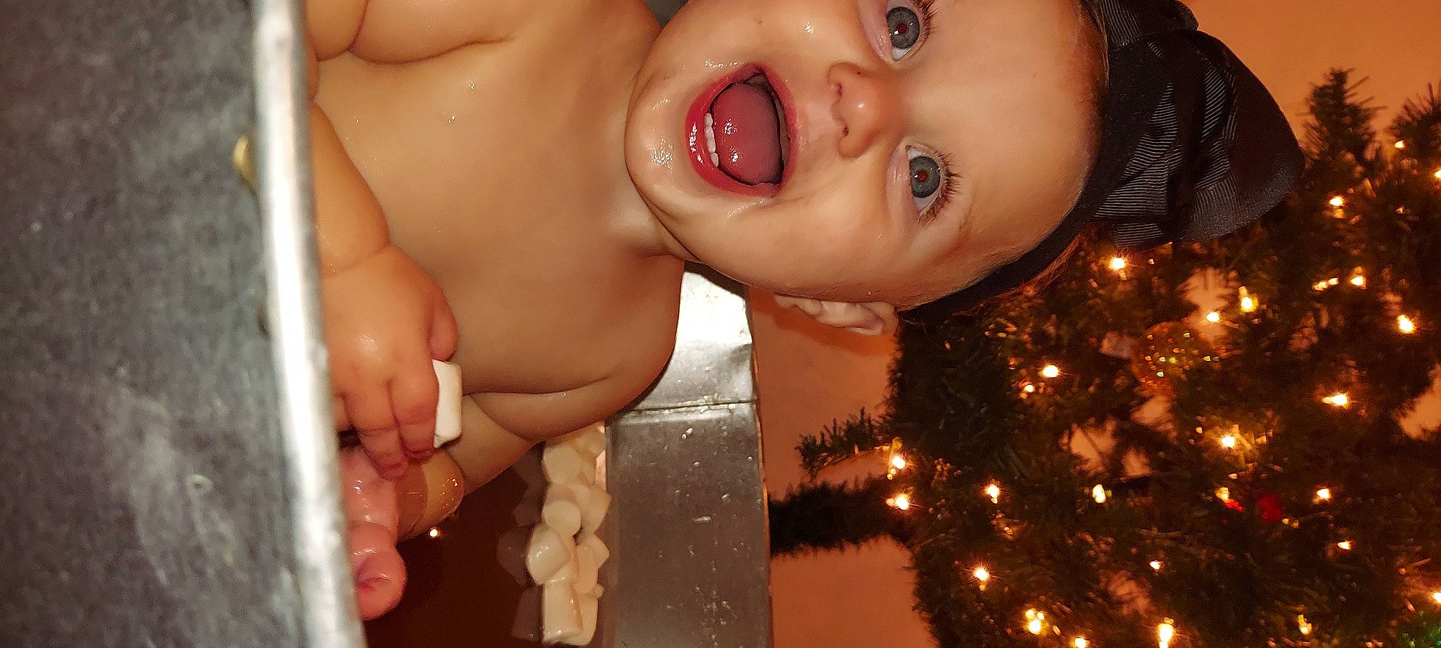 Makenzie is registered to the contest to win money with this photo: cheek, christmas_decoration, christmas_ornament, christmas_tree, eye, eyelash, face, facial_expression, finger, happy, head, human, human_body, lip, mouth, nose, organ, people_in_nature, person, skin