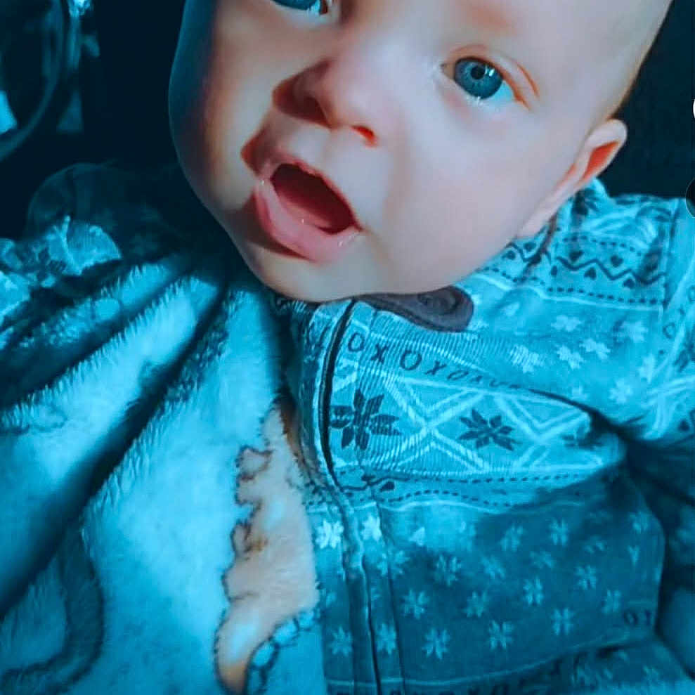 Aerian joined the competition — help win amazing prizes! baby, blanket, blue_eyes, clothing, cozy, cute, face, indoors, infant, looking, mouth_open, onesie, patterned, portrait, sleepwear, snug, soft_texture, toddler, warm, young_child