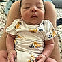 Sebastian joined the competition — help win amazing prizes! baby, sleeping, infant, onesie, animal_print, hands, legs, lap, person, indoor, bed, blanket, comfort, cute, peaceful, skin, face, hair, relaxation, child