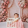 baby, child, infant, portrait, smiling, sitting, crib, dress, pink, flowers, roses, crown, headband, indoor, studio, fairytale, decor, floral, vintage, photography