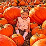 child, baby, toddler, smiling, portrait, pumpkin, pumpkin_patch, autumn, fall, outdoor, farm, harvest, orange, pink_dress, pigtails, sitting, boots, nature, sunlight, seasonal