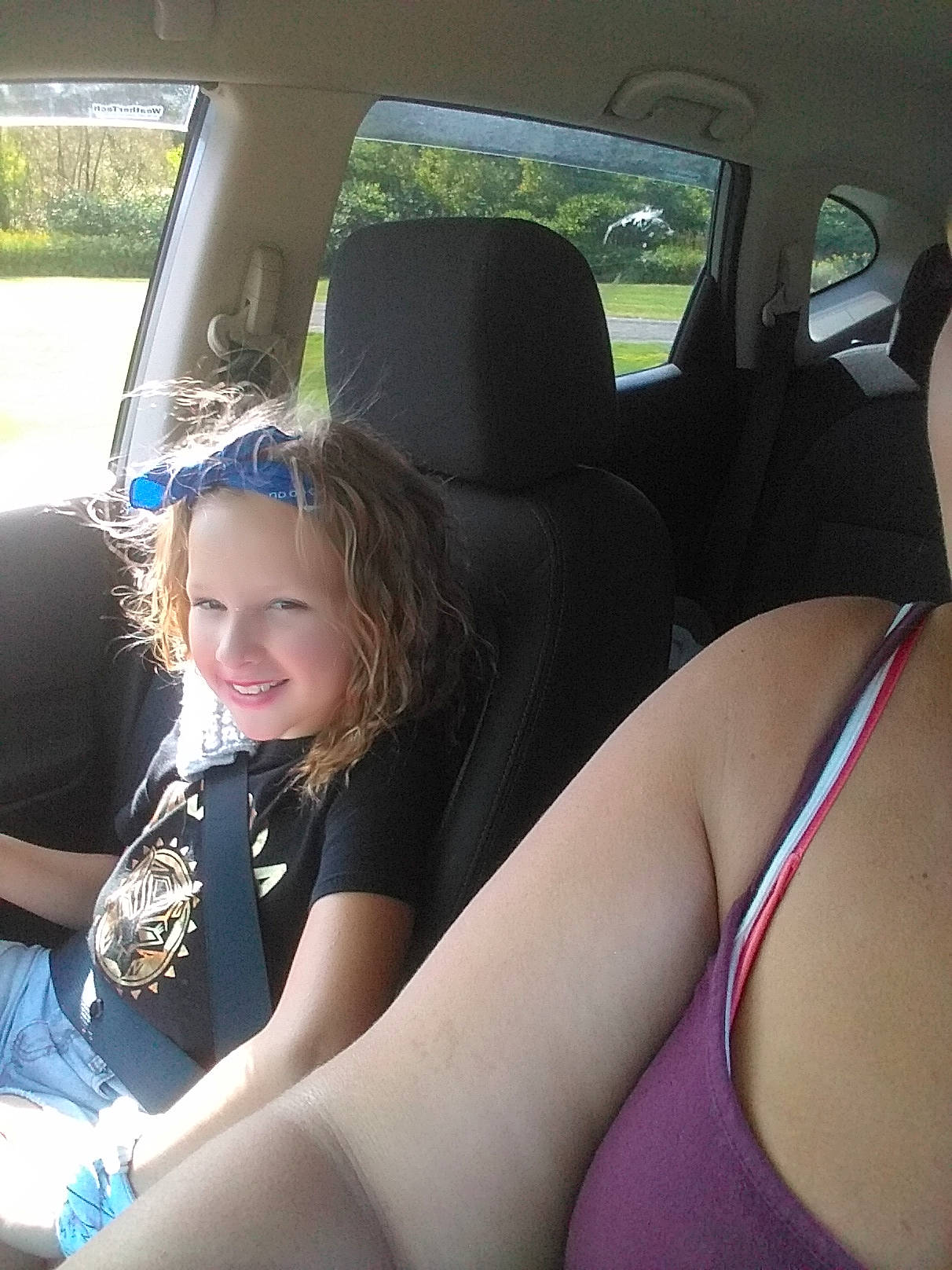 Abbigail joined the competition — help win amazing prizes! auto_part, black_hair, car, car_seat, car_seat_cover, driving, family_car, fun, head_restraint, joy, leg, person, plant, steering_wheel, subcompact_car, summer, thigh, vacation, vehicle, vehicle_door