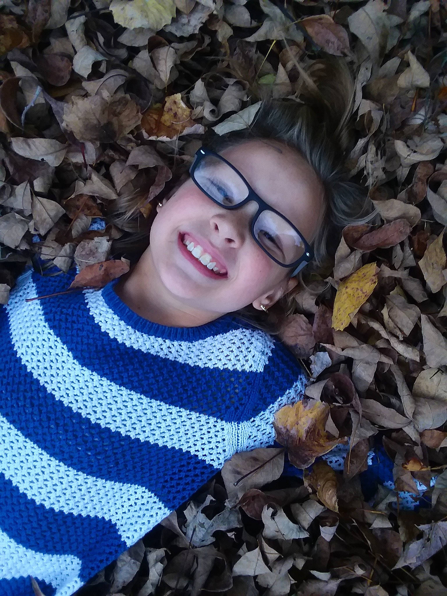 Abbigail is registered to the contest to win money with this photo: autumn, beauty, camouflage, cool, eyewear, fun, glasses, headwear, joy, leaf, pattern, person, photography, portrait, smile, tree, vision_care