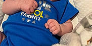 Eastyn is registered to the contest to win money with this photo: baby, baby_seat, blanket, blue_onesie, child, comfort, cozy, cushion, cute, hands, happy, head, indoor, infant, portrait, skin, small, smiling, soft_toy, young