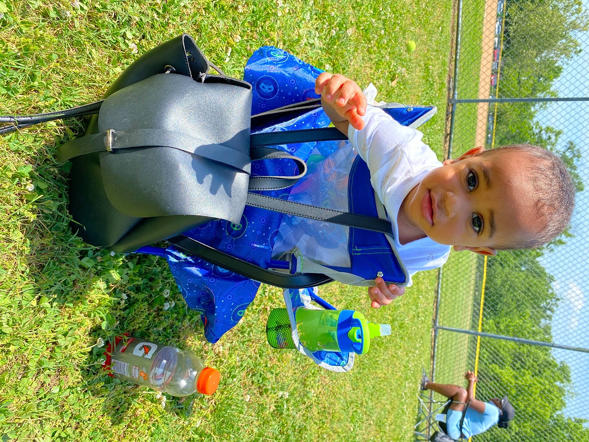 Emir is registered to the contest to win money with this photo: baby, baby_products, blue, child, city, electric_blue, fun, grass, lawn, leisure, people_in_nature, person, plant, plastic, play, recreation, sky, smile, toddler, tree