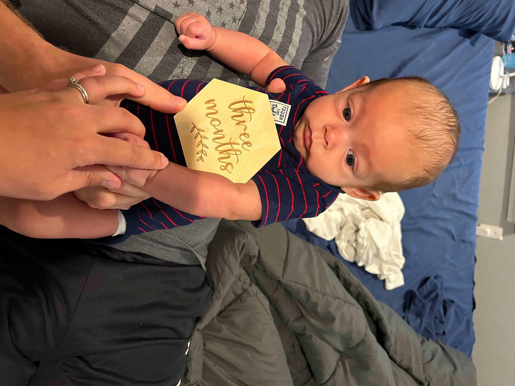 Alex is registered to the contest to win money with this photo: baby, baby_toddler_clothing, child, comfort, elbow, finger, fun, gesture, hat, human_leg, knee, nail, person, plant, sitting, skin, thigh, thumb, toddler, tree