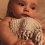 Leviacus is registered to the contest to win money with this photo: baby, blanket, child, closeup, cozy, cute, face, hand, indoor, infant, knitted, newborn, peaceful, person, portrait, resting, skin, sleepy, soft_light, young