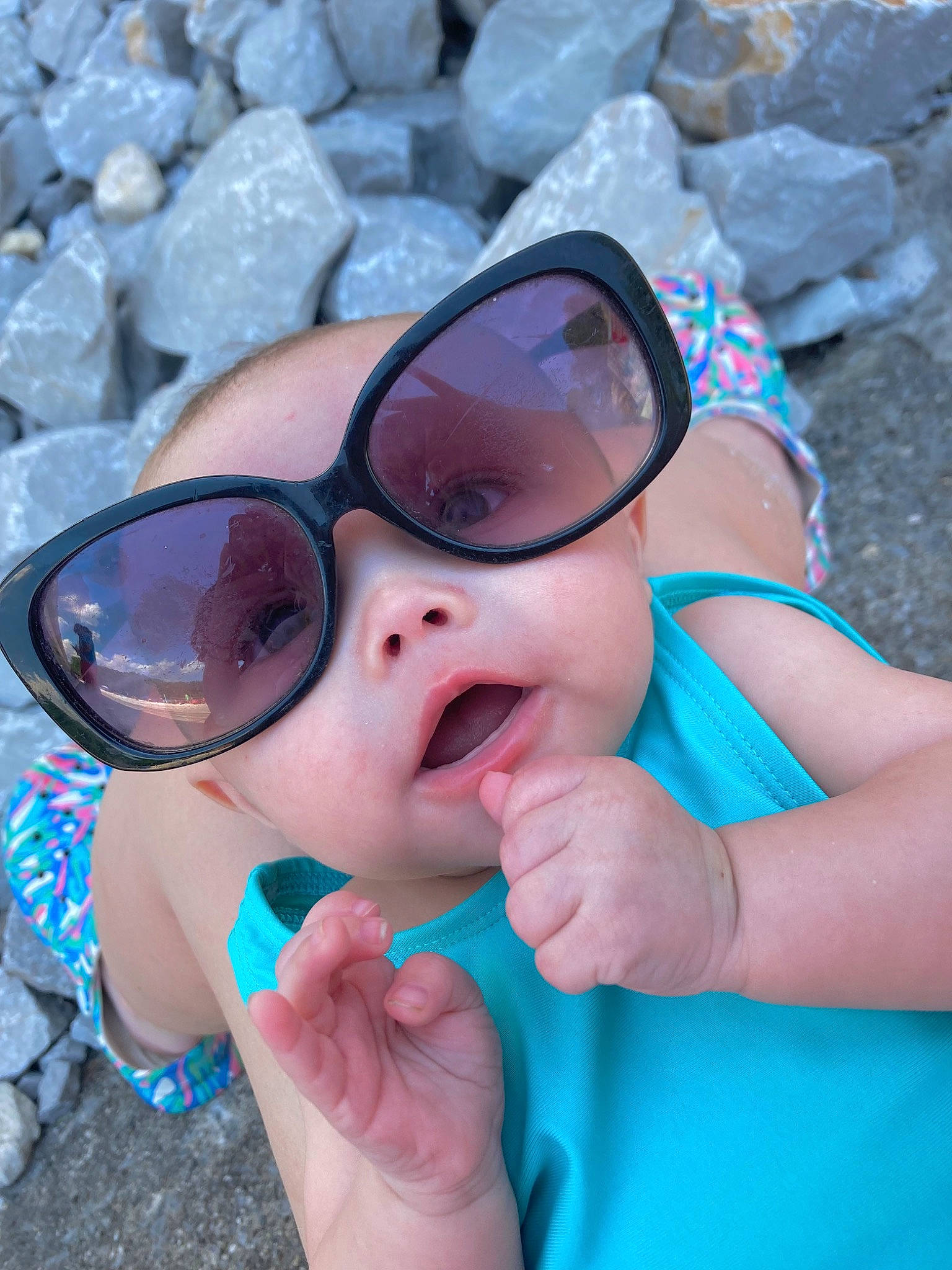 Myla joined the competition — help win amazing prizes! azure, baby_toddler_clothing, blue, eye, eyewear, face, finger, gesture, glasses, goggles, hand, happy, head, headwear, lip, mouth, person, pink, skin, sunglasses
