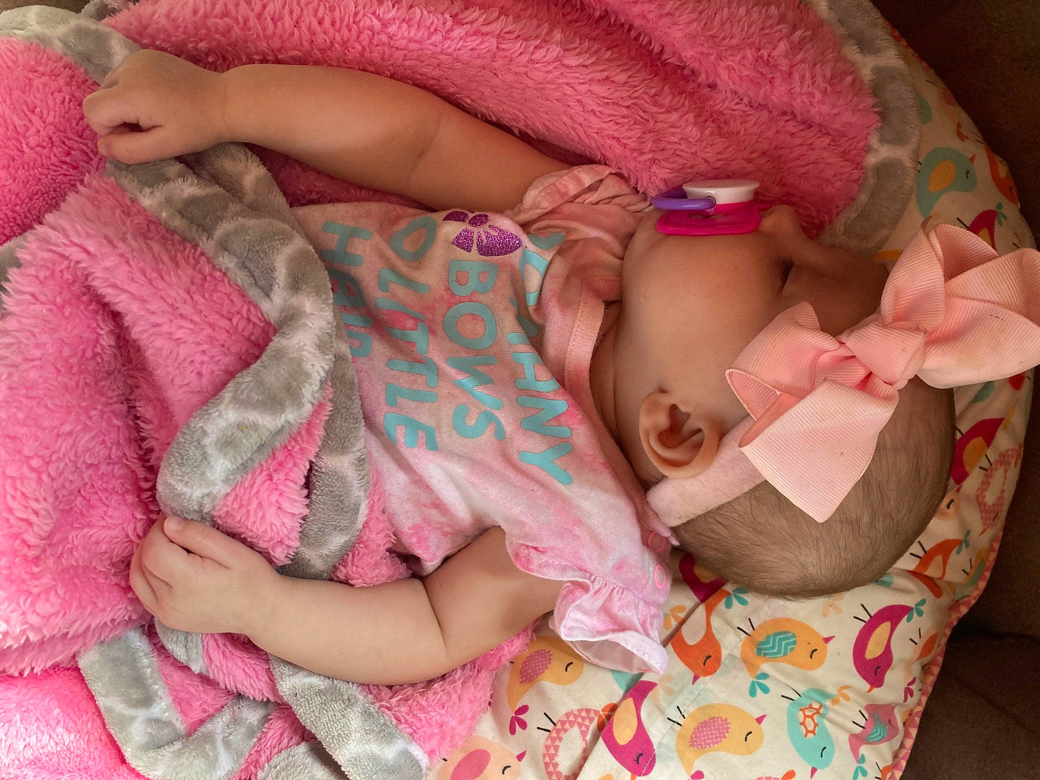 Myla is registered to the contest to win money with this photo: arm, baby, baby_sleeping, baby_toddler_clothing, cheek, comfort, dress, eye, finger, hand, human_body, leg, mouth, nail, pink, product, skin, sleeve, textile, toddler