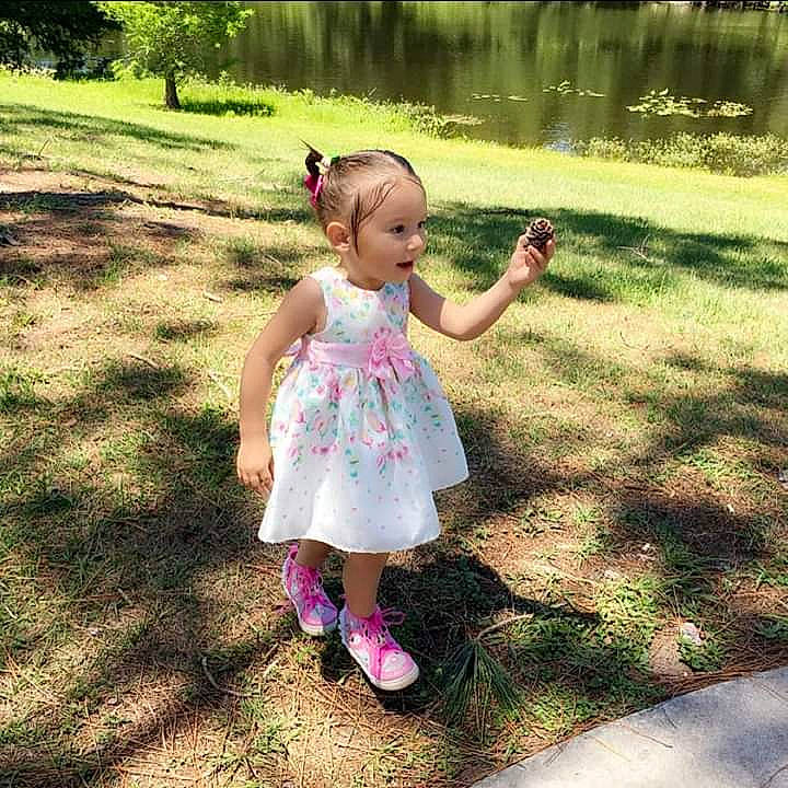 Heavenly Serenity Taber is registered to the contest to win money with this photo: baby, beauty, child, dress, flower, footwear, grass, happy, person, photography, pink, plant, play, recreation, shoe, smile, summer, toddler, tree, vacation