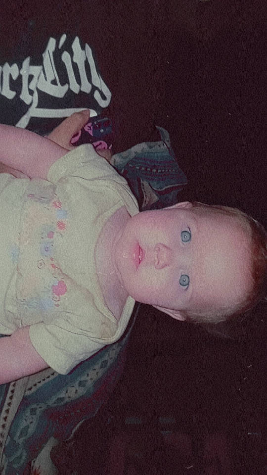 Hagen is registered to the contest to win money with this photo: baby_toddler_clothing, cheek, chest, child, elbow, flesh, fun, gesture, hat, human_leg, mouth, person, pink, sitting, sleeve, thigh, thumb, toddler, trunk, wrist