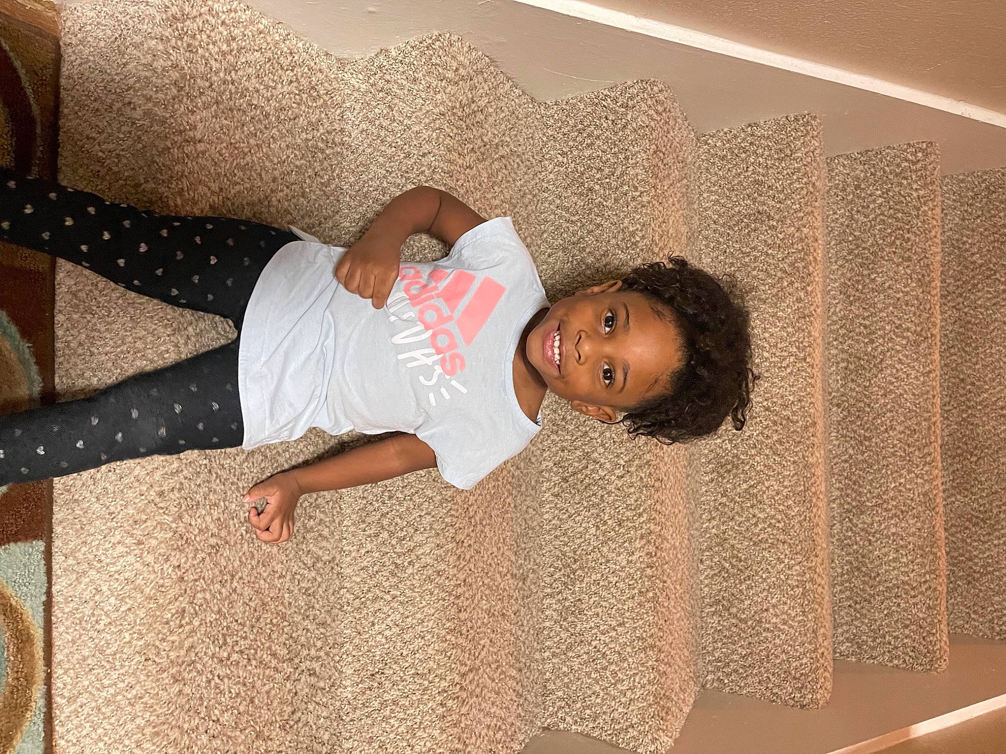 Nyla Faith is registered to the contest to win money with this photo: baby_toddler_clothing, beauty, child, comfort, elbow, floor, flooring, fun, hardwood, human_leg, joy, linens, pattern, person, room, textile, thigh, toddler, wood, wrist
