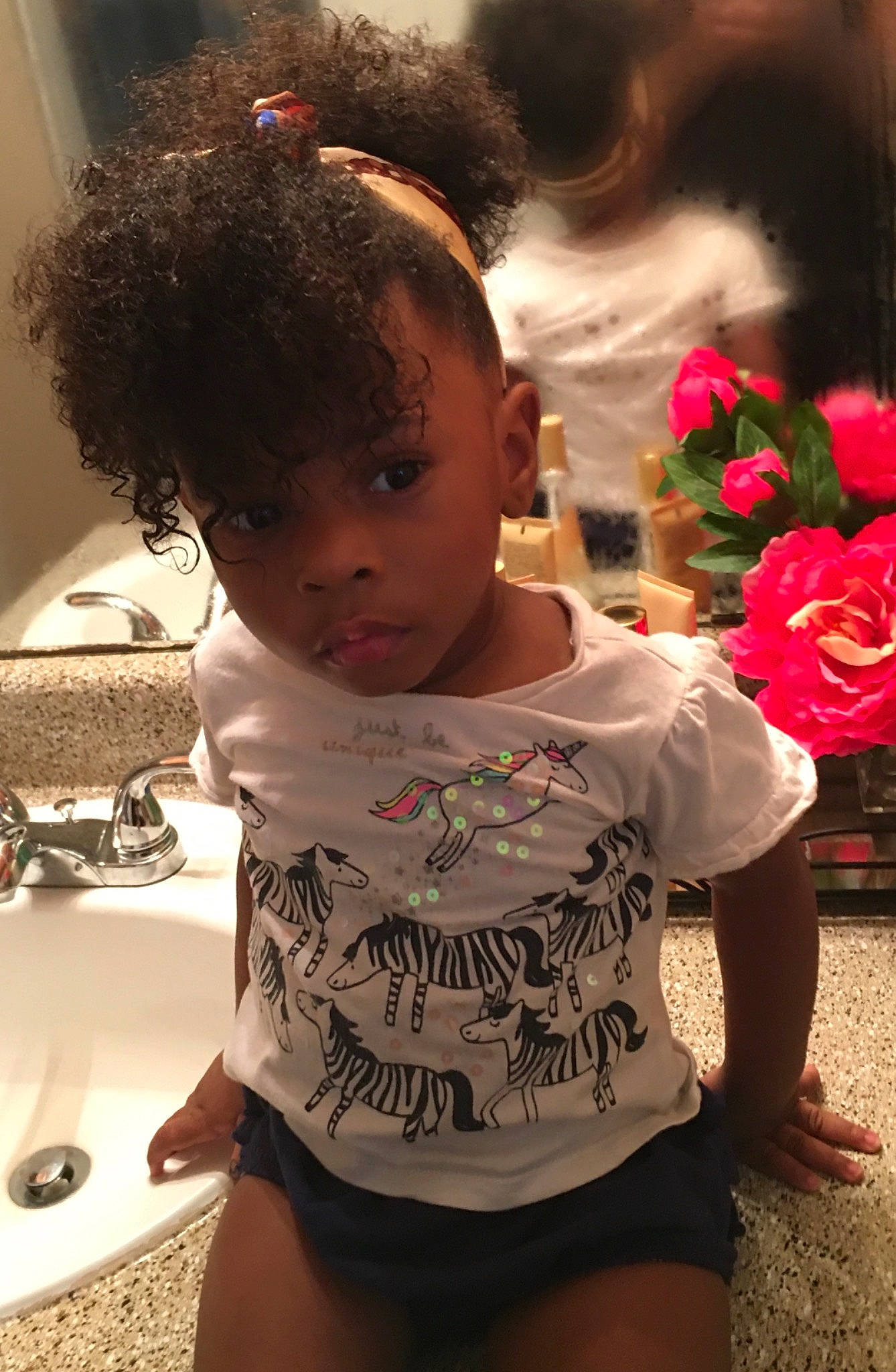 Nyla Faith is registered to the contest to win money with this photo: baby, bathroom, black, child, flower, fun, hair, happy, human, iris, person, petal, plant, plumbing_fixture, rose, shorts, skin, tap, thigh, toddler