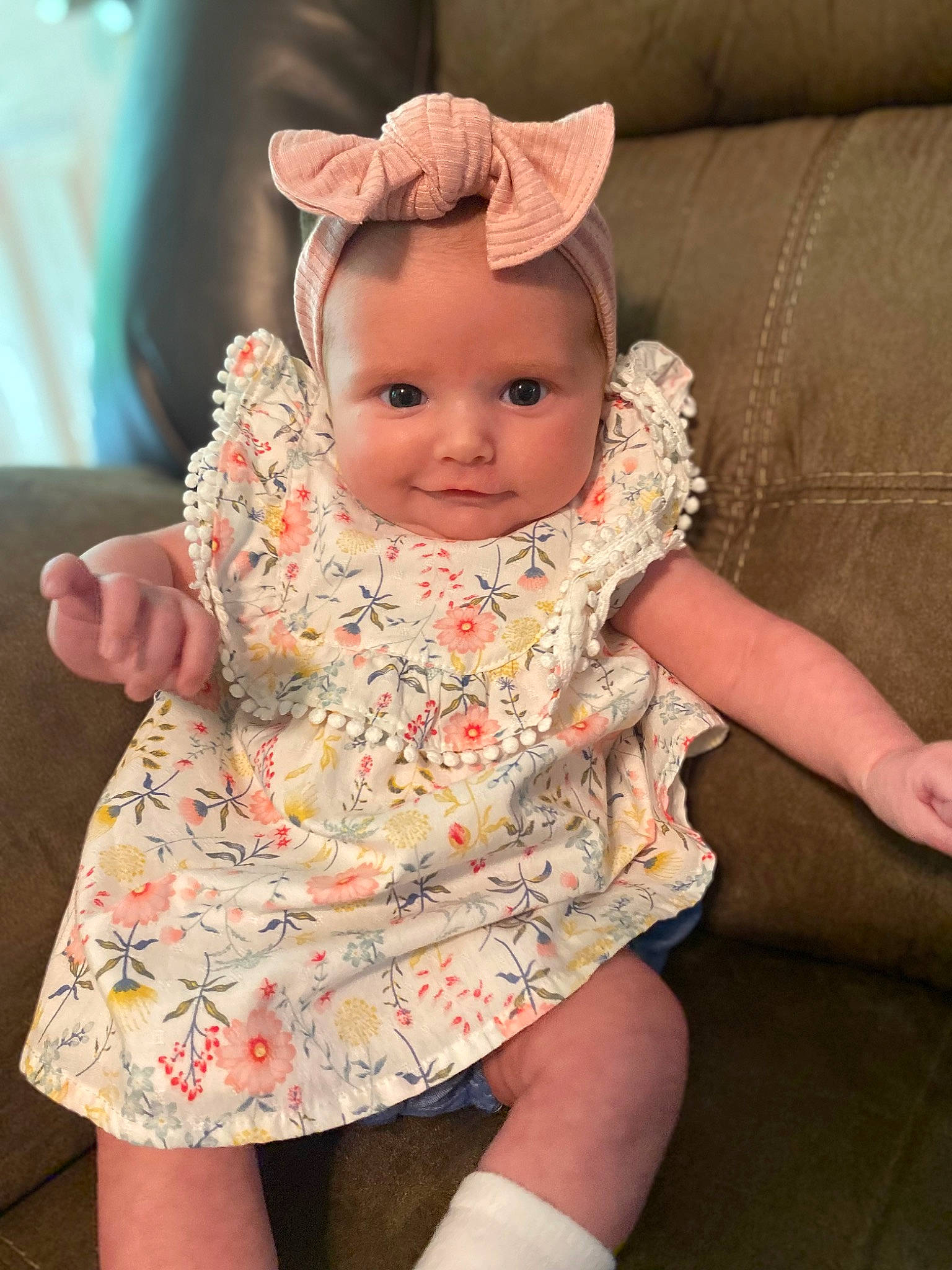 Oaklee is registered to the contest to win money with this photo: baby, baby_toddler_clothing, cheek, child, comfort, day_dress, dress, embellishment, eye, happy, head, headpiece, human_body, iris, neck, person, pink, skin, sleeve, textile