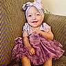 Jayla joined the competition — help win amazing prizes! baby, child, smile, dress, headband, bow, purple, couch, striped, happy, sitting, cute, infant, person, portrait, indoors, clothing, face, hand, toddler