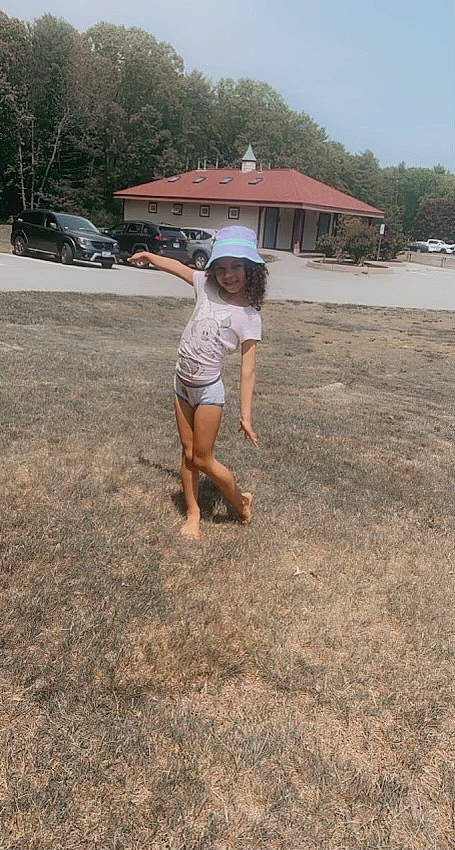 Gianalee joined the competition — help win amazing prizes! asphalt, barefoot, car, foot, fun, grass, headwear, human_leg, joy, landscape, leisure, person, road, road_surface, sand, shorts, sky, soil, t_shirt, tire