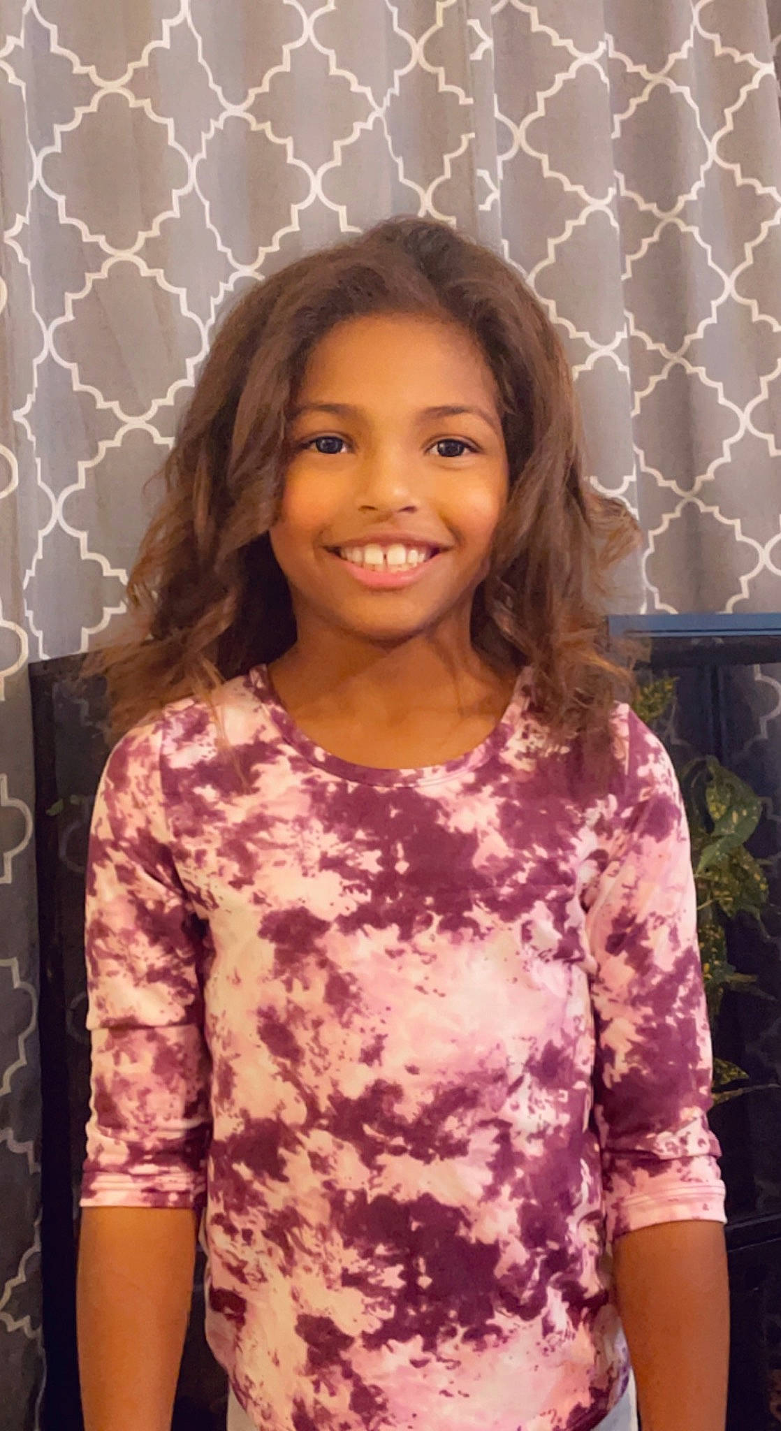 Kiara is registered to the contest to win money with this photo: child, facial_expression, fun, hair, hairstyle, happy, head, iris, joy, long_hair, magenta, military_camouflage, pattern, person, pink, shoulder, skin, sleeve, smile, standing