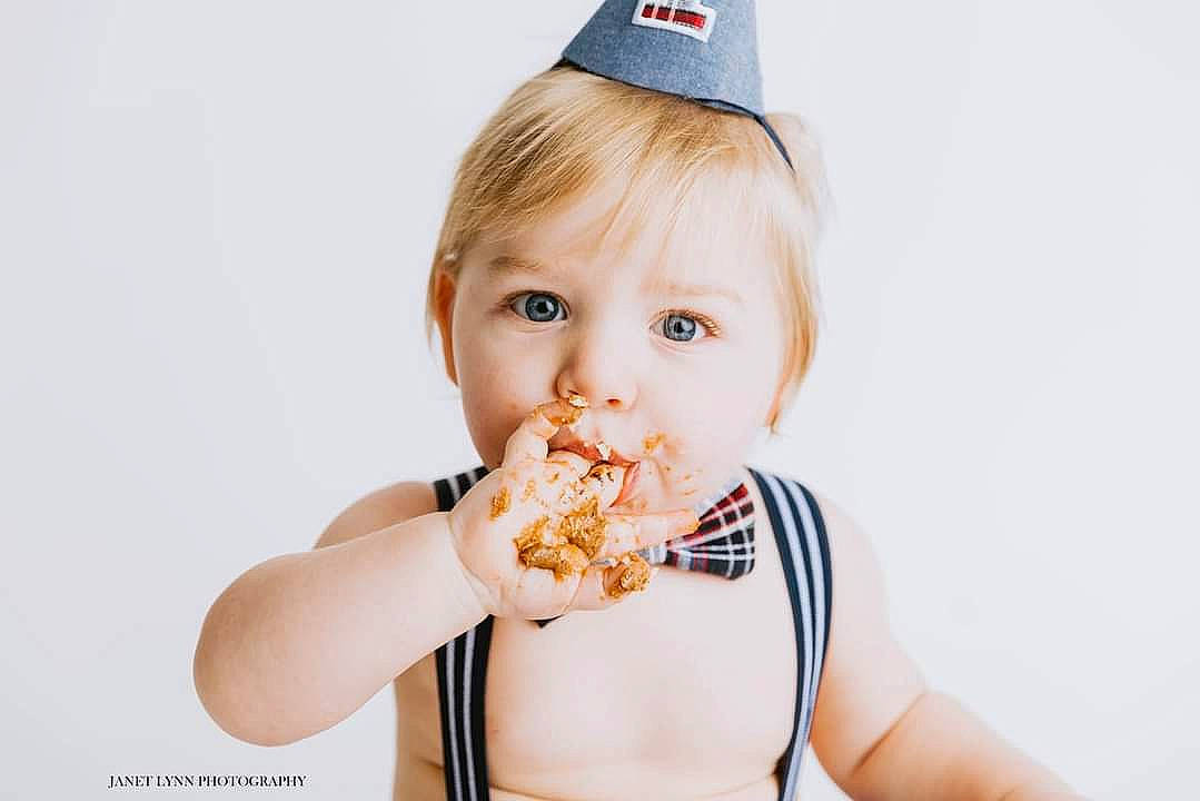 Brantlee is registered to the contest to win money with this photo: baseball_cap, biting, cap, child, comfort_food, costume_hat, cuisine, dish, eating, fashion_accessory, finger_food, food, food_craving, gesture, happy, junk_food, person, portrait_photography, sweetness, taste
