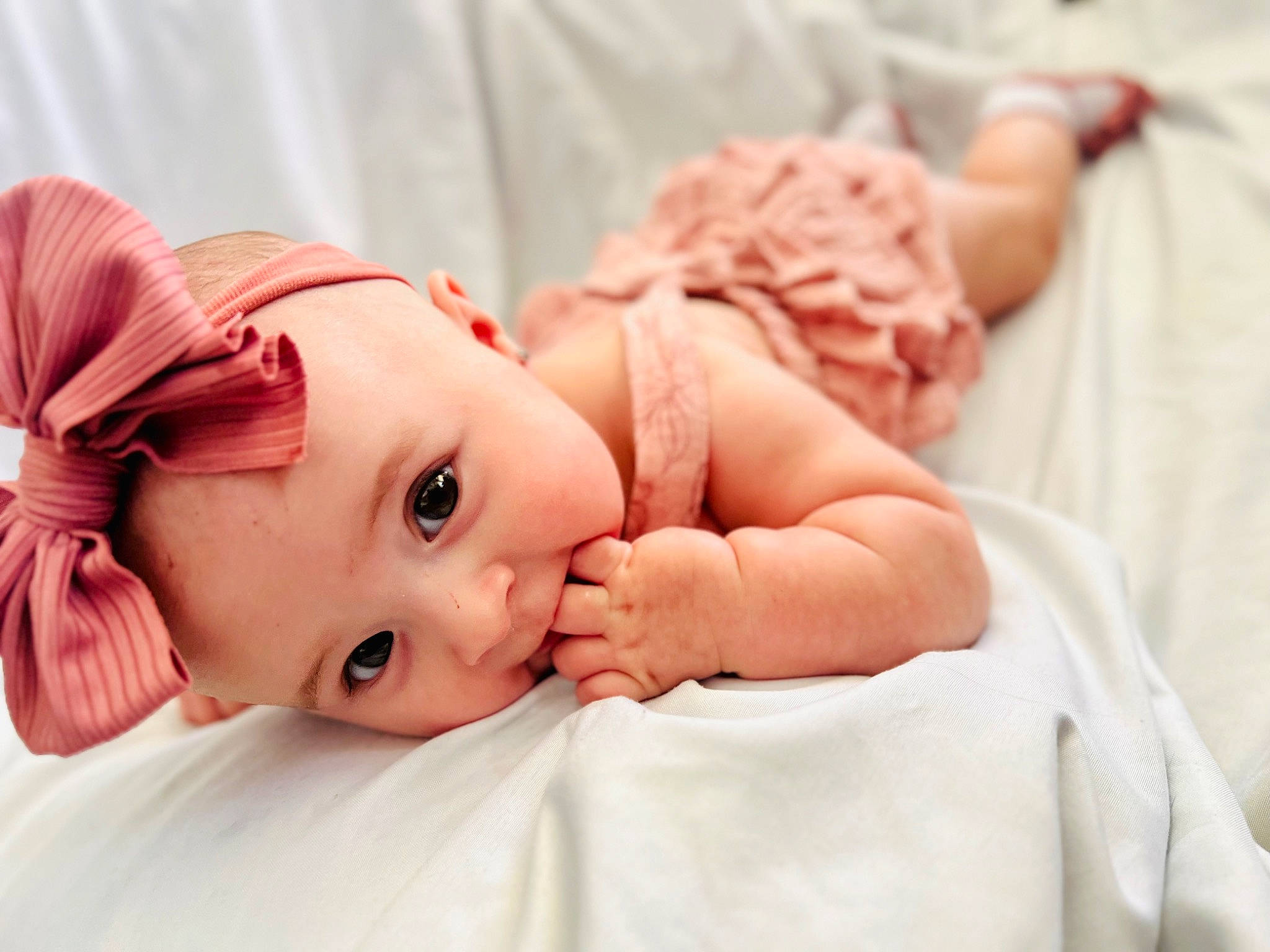 Hollis joined the competition — help win amazing prizes! baby, baby_toddler_clothing, cheek, child, comfort, dress, eye, eyebrow, eyelash, finger, gesture, grass, hand, happy, headpiece, headwear, lip, peach, person, pink