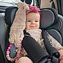 Valentina participe au concours pour gagner de l'argent avec cette photo : baby, child, car_seat, plush_toy, headband, pink, smile, pacifier_clip, beads, car_interior, window, seatbelt, cute, infant, safety_harness, toy, person, travel, young_child, happy
