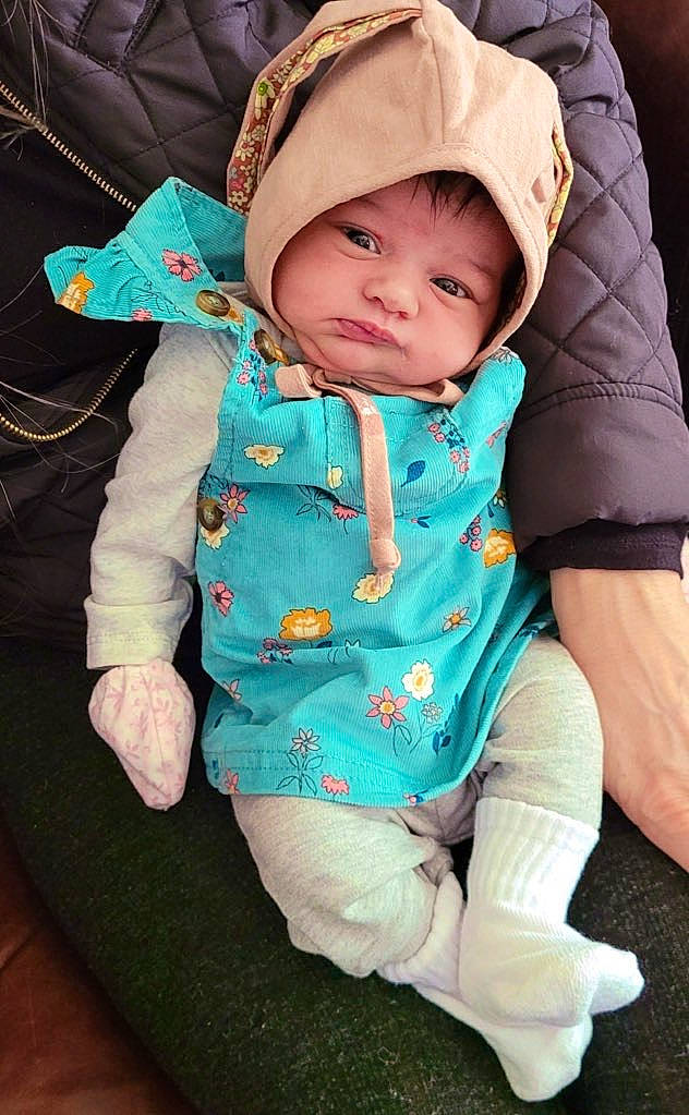 Harlow joined the competition — help win amazing prizes! baby, baby_products, baby_toddler_clothing, cap, cheek, child, collar, comfort, eye, foot, grass, happy, headwear, human_body, outerwear, person, play, sitting, skin, sleeve