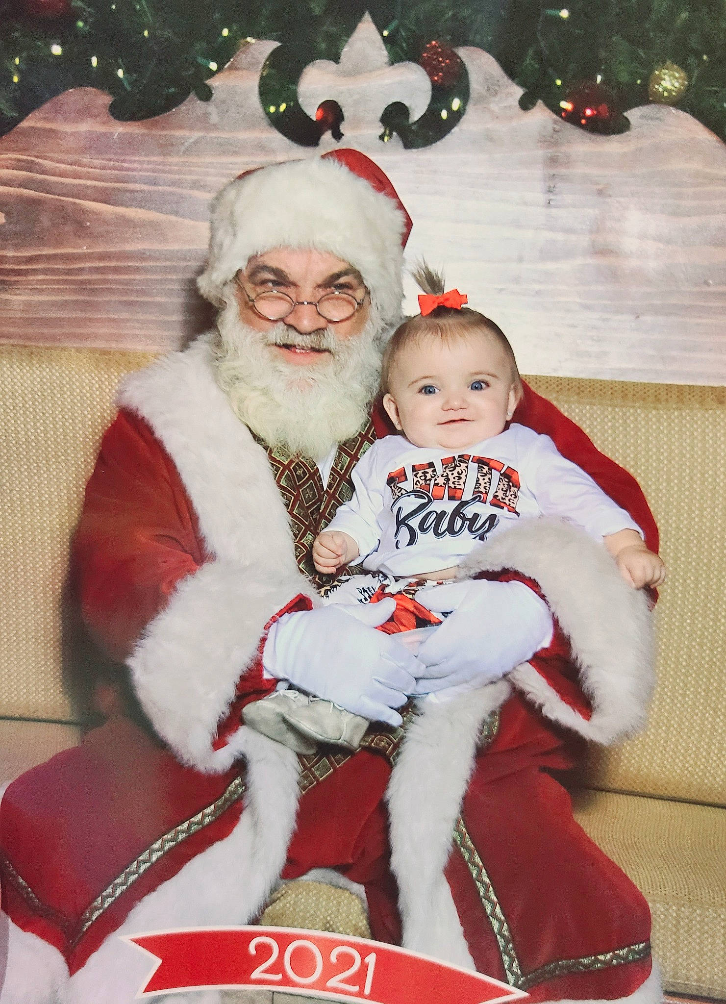 Ellie Mae joined the competition — help win amazing prizes! baby, beard, child, christmas, christmas_ornament, christmas_tree, event, face, fun, happy, hat, headwear, holiday, joy, lap, person, red, santa_claus, smile, toddler