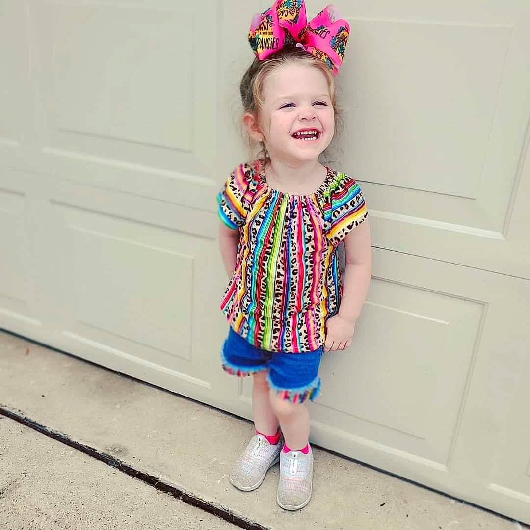 Aizlyn joined the competition — help win amazing prizes! baby_toddler_clothing, child, clothing, design, dress, ear, fashion_accessory, footwear, hair_accessory, headband, headgear, joy, outerwear, pattern, person, pink, sleeve, smile, textile, toddler