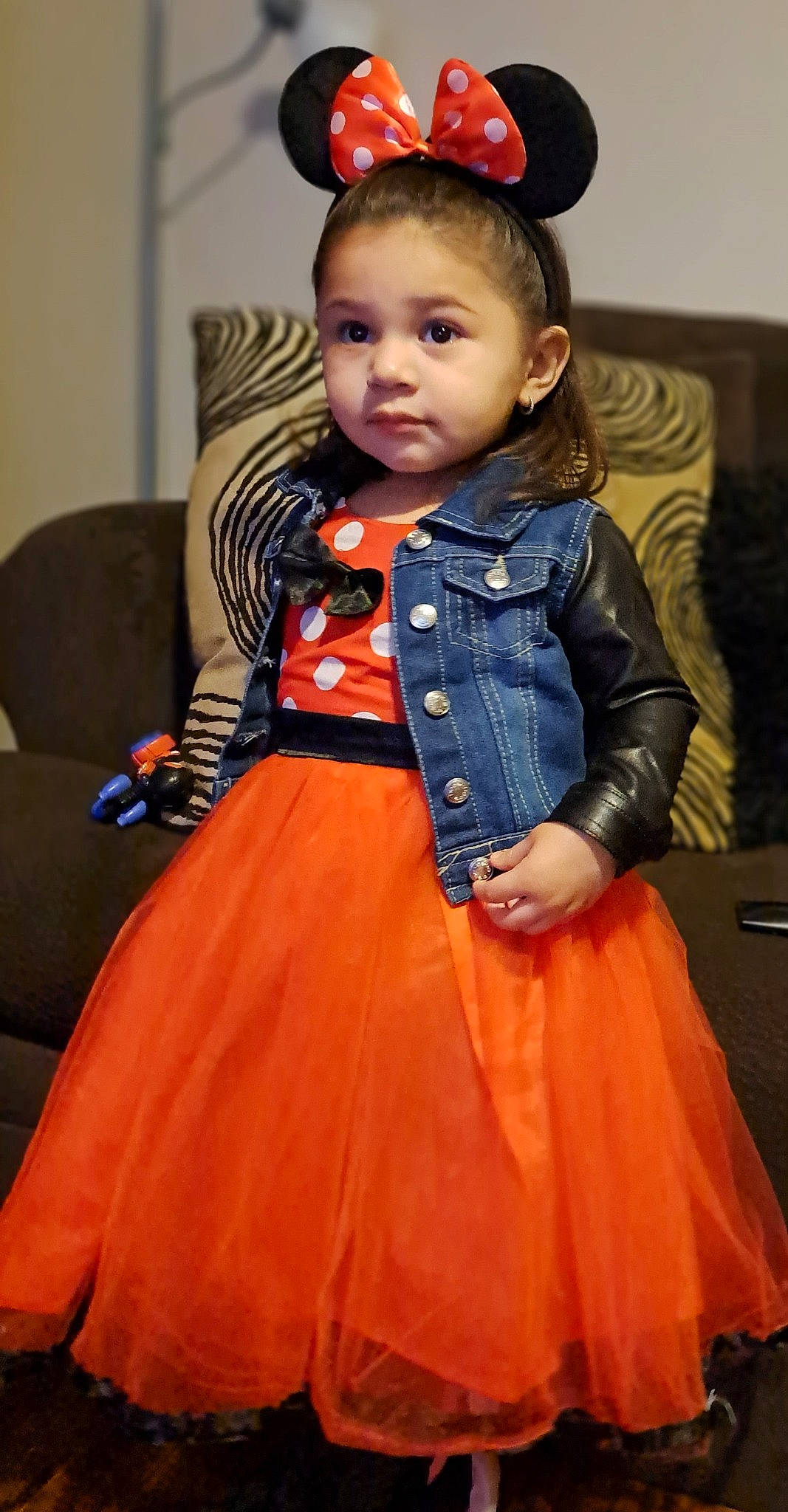 Maddison is registered to the contest to win money with this photo: baby_toddler_clothing, chin, clothing, day_dress, dress, eye, face, facial_expression, hair, head, human_body, iris, neck, one_piece_garment, orange, person, pink, skin, sleeve, textile