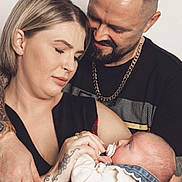 Yazmin joined the competition — help win amazing prizes! baby, mother, father, family, love, affection, portrait, indoor, holding, pacifier, tattoo, watch, chain_necklace, clothing, denim, closeup, caring, expression, skin, head