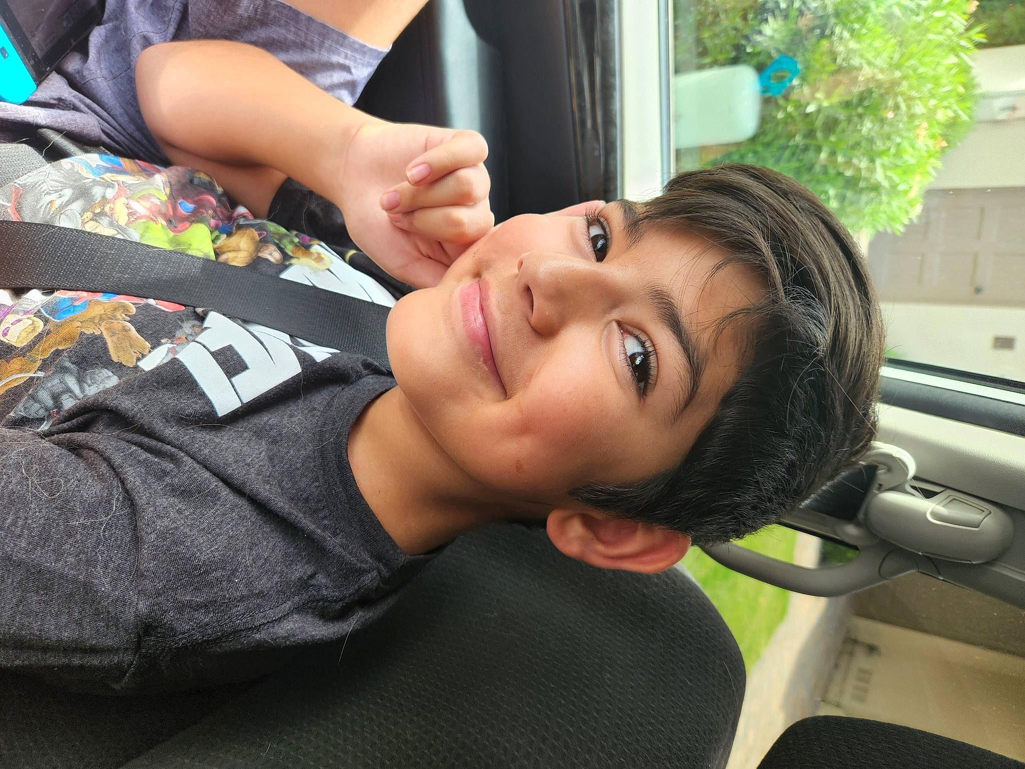 Deklend is registered to the contest to win money with this photo: automotive_design, automotive_exterior, beauty, black_hair, dress, eyelash, family_car, finger, grass, hand, happy, joint, joy, leg, long_hair, motor_vehicle, person, plant, smile, tree