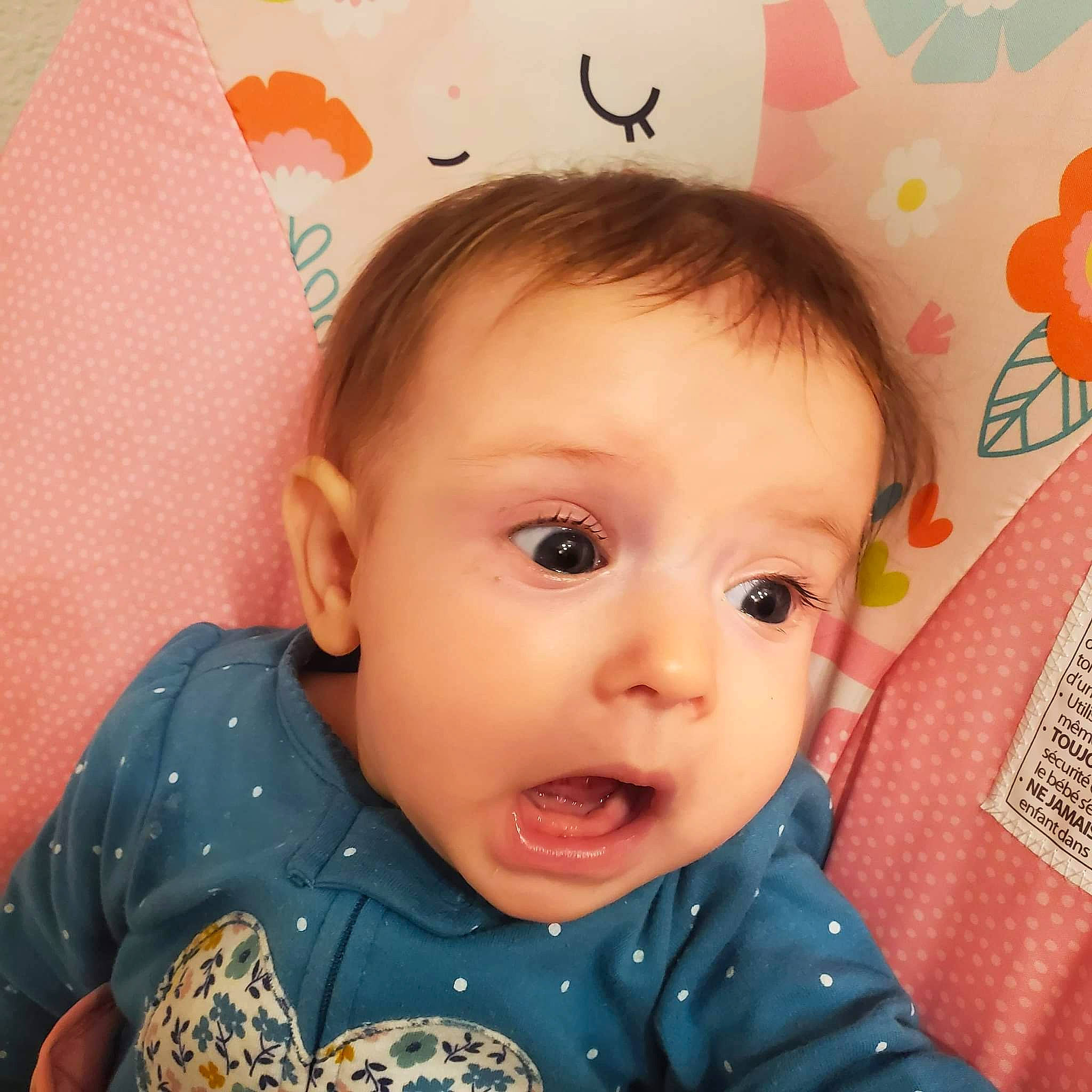 Cherry is registered to the contest to win money with this photo: baby, baby_making_funny_faces, baby_products, baby_toddler_clothing, cheek, child, ear, eyelash, fashion_accessory, happy, iris, linens, nose, pattern, person, pink, room, skin, sleeve, smile