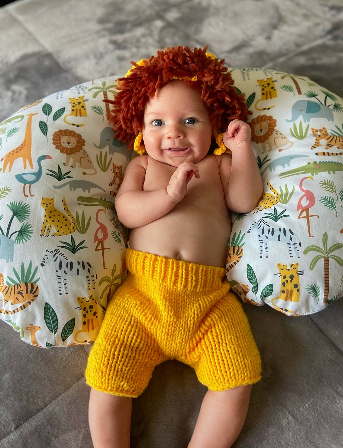 Kane is registered to the contest to win money with this photo: abdomen, baby_toddler_clothing, cheek, chest, comfort, hair, happy, head, human_body, knee, neck, orange, people_in_nature, person, skin, smile, textile, thigh, toddler, trunk