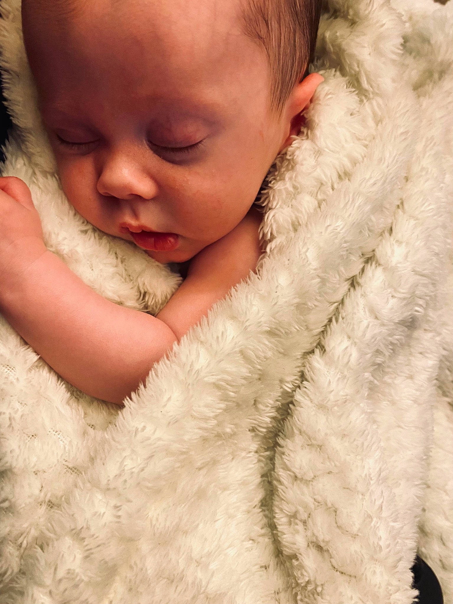 Remi is registered to the contest to win money with this photo: baby, baby_toddler_clothing, cheek, child, comfort, ear, eyebrow, eyelash, face, fur, fur_clothing, gesture, happy, iris, lip, nail, neck, nose, person, skin