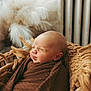 Kohen is registered to the contest to win money with this photo: newborn, baby, sleeping, basket, blanket, brown, cozy, infant, wrapped, face, peaceful, indoors, soft, decor, furniture, portrait, cute, resting, head, child