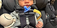 Kohen joined the competition — help win amazing prizes! baby, infant, car_seat, pacifier, hooded_clothing, straps, foot, hand, cute, child, safety, indoor, seat_belt, gray_clothing, newborn, person, portrait, small_feet, expression, toddler