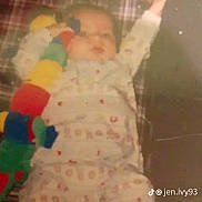 Bradley joined the competition — help win amazing prizes! baby, child, pajamas, plush_toy, caterpillar, blanket, patterned_clothing, socks, lying_down, infant, indoor, soft_toy, cute, sleepwear, young_child, one_arm_up, tiktok_watermark, plaid_pattern, floor, resting