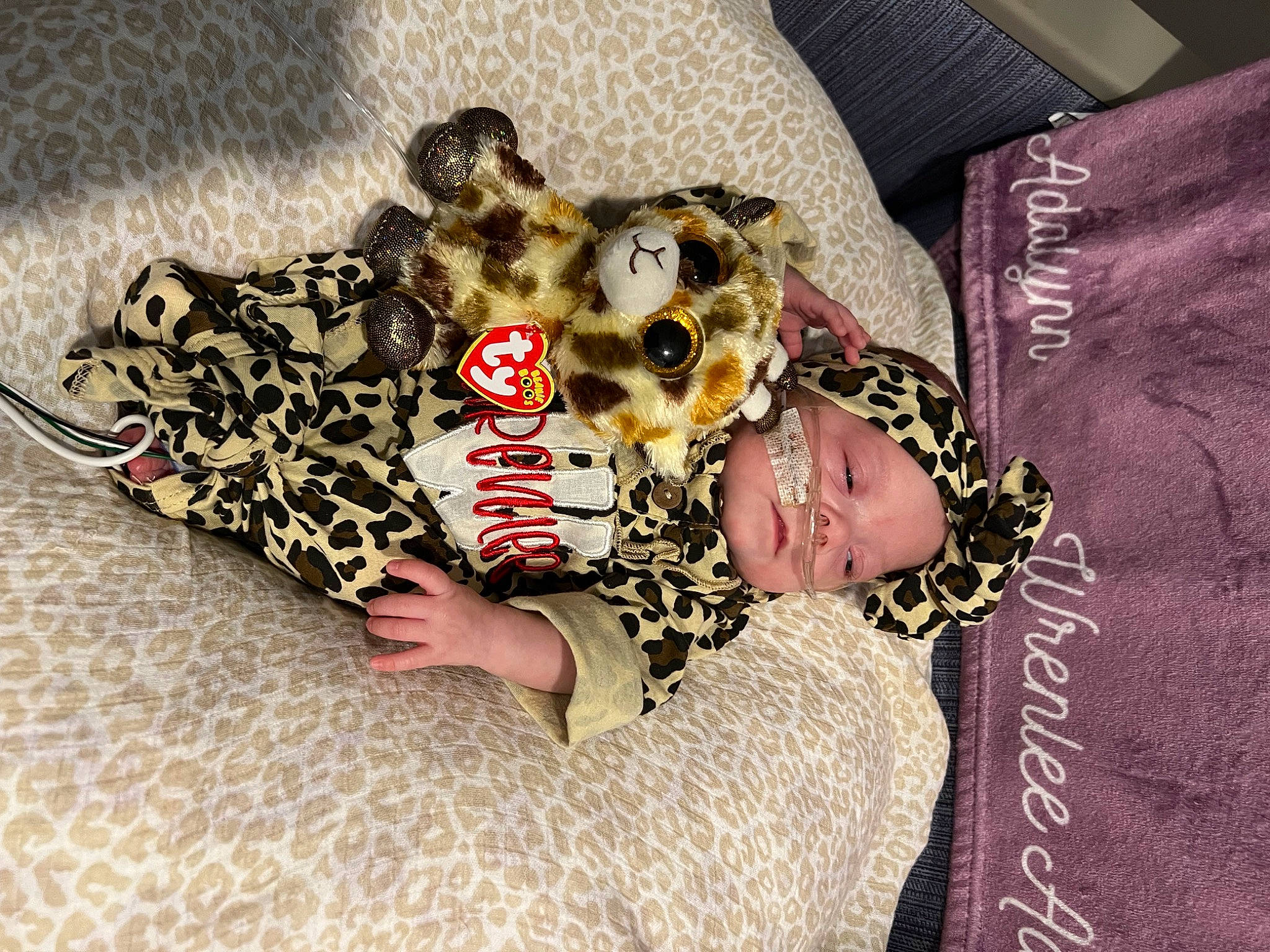 Wrenlee is registered to the contest to win money with this photo: baby_products, baby_toddler_clothing, bedding, child, comfort, dress, fashion_accessory, font, fur, happy, headwear, jewellery, linens, pattern, person, room, sleeve, smile, stuffed_toy, toddler