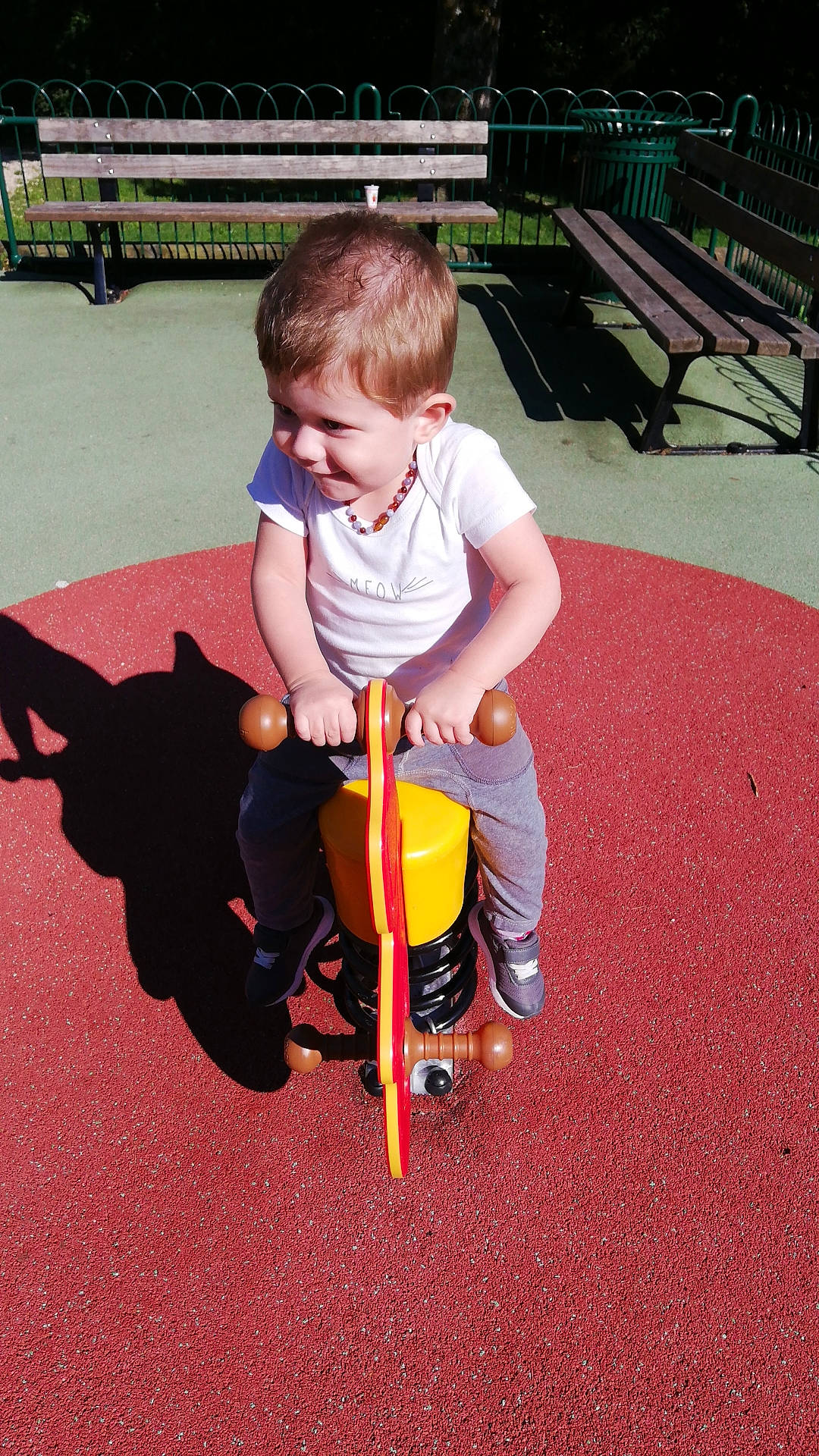 Kenzo participe au concours pour gagner de l'argent avec cette photo : child, city, fun, human_settlement, outdoor_play_equipment, person, play, playground, public_space, recreation, toddler, vehicle