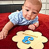 Matthew joined the competition — help win amazing prizes! arm, baby, bed, blue_shirt, child, cute, expression, eyes, face, furniture, hand, indoors, infant, lying_down, milestone, months, number_3, portrait, red_blanket, wooden_plaque