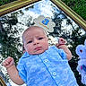 3_months, baby, blue_shirt, bracelet, cute, expression, fist, fluffy_toy, golden_frame, grass, infant, milestone_sign, mirror, outdoor, portrait, red_band, reflection, sky, toy, trees