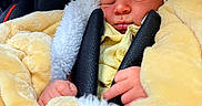 Matthew is registered to the contest to win money with this photo: newborn, baby, sleeping, blanket, yellow_blanket, car_seat, black_straps, infant, cozy, soft_texture, child, peaceful, portrait, wrapped, cute, indoors, close_up, small_hands, resting, comfort