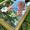 Matthew joined the competition — help win amazing prizes! 3_months, baby, blue_clothing, bracelet, close_up, cute, face, gold_frame, grass, grass_blades, hand, infant, mirror, nature, outdoor, portrait, reflection, sky_reflection, trees, wooden_sign